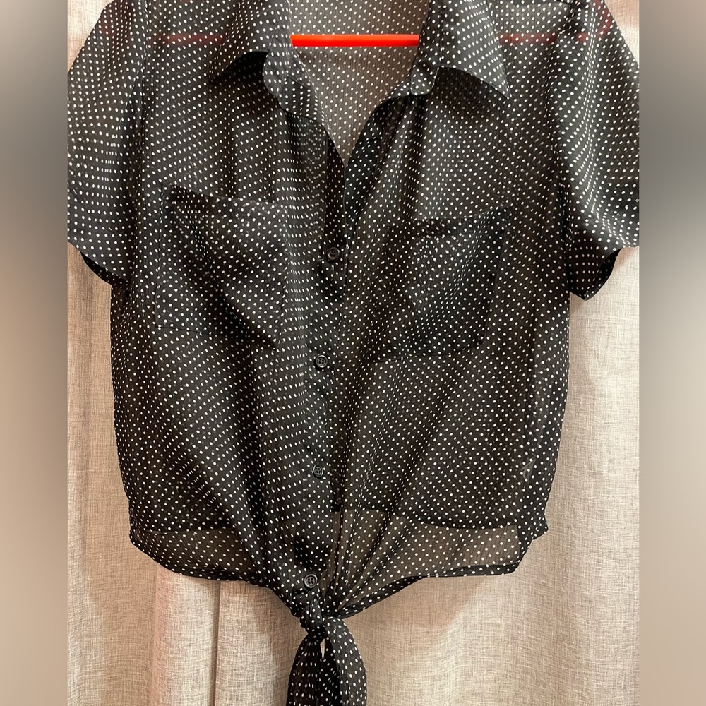 Sheer black and white polka dot short sleeved shirt with front tie. Size M